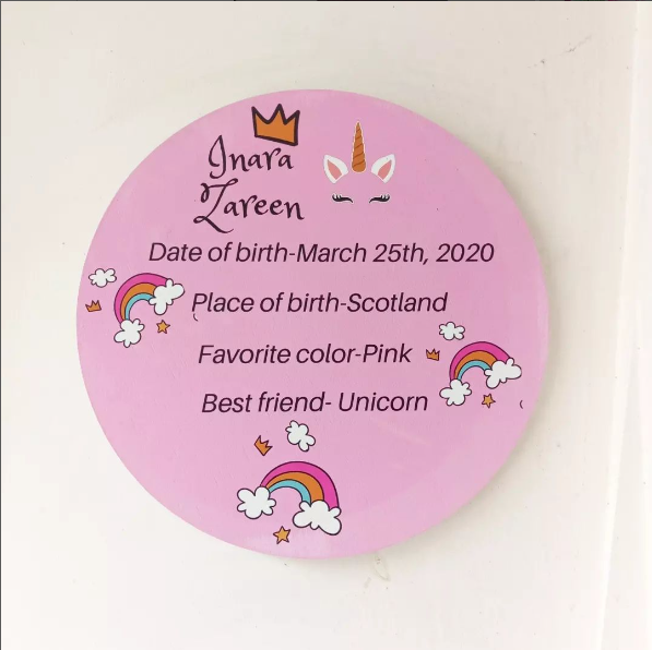 Its a customized wooden name plaque/wall hanging with unicorn and rainbows theme.