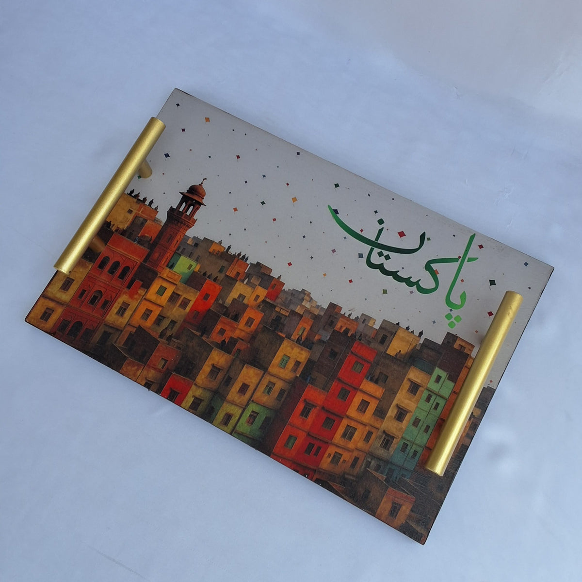 wooden tray . serving tray .Decorative tray with colorful cityscape design and 'Pakistan' text on a white background