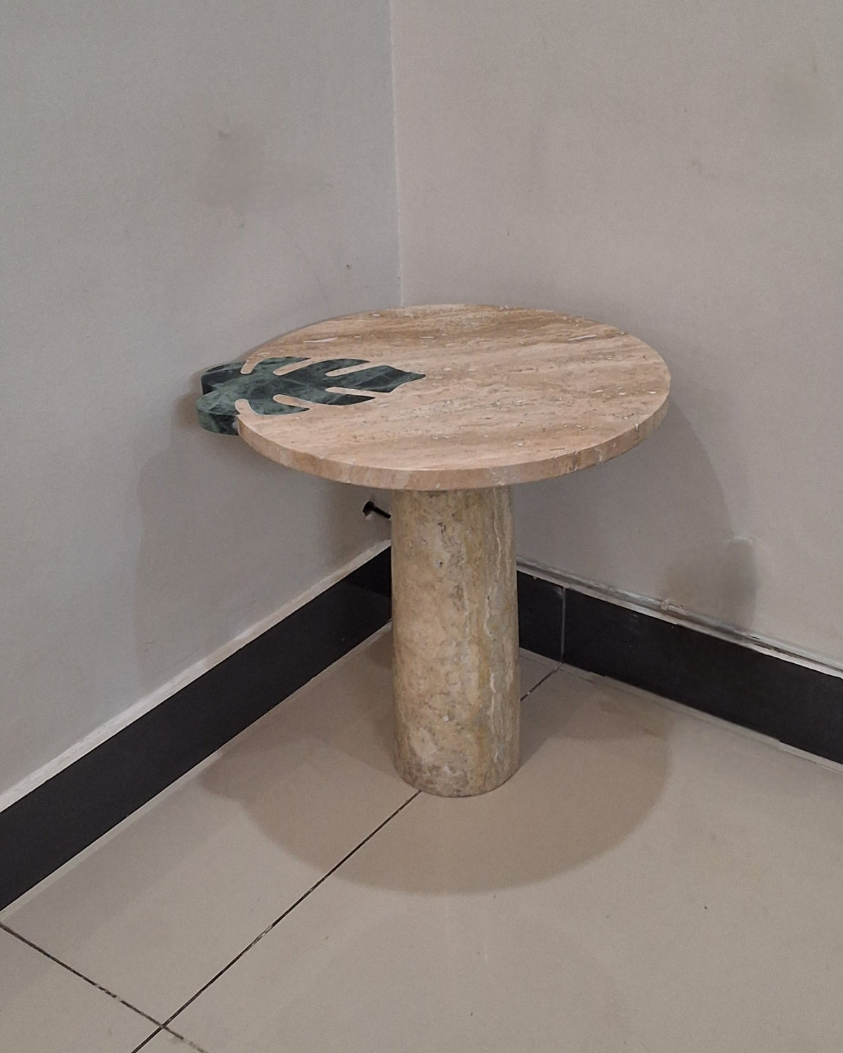 handmade Travertine and Marble table crafted using Pietra Dura technique. luxurious home decor in Pakistan. 