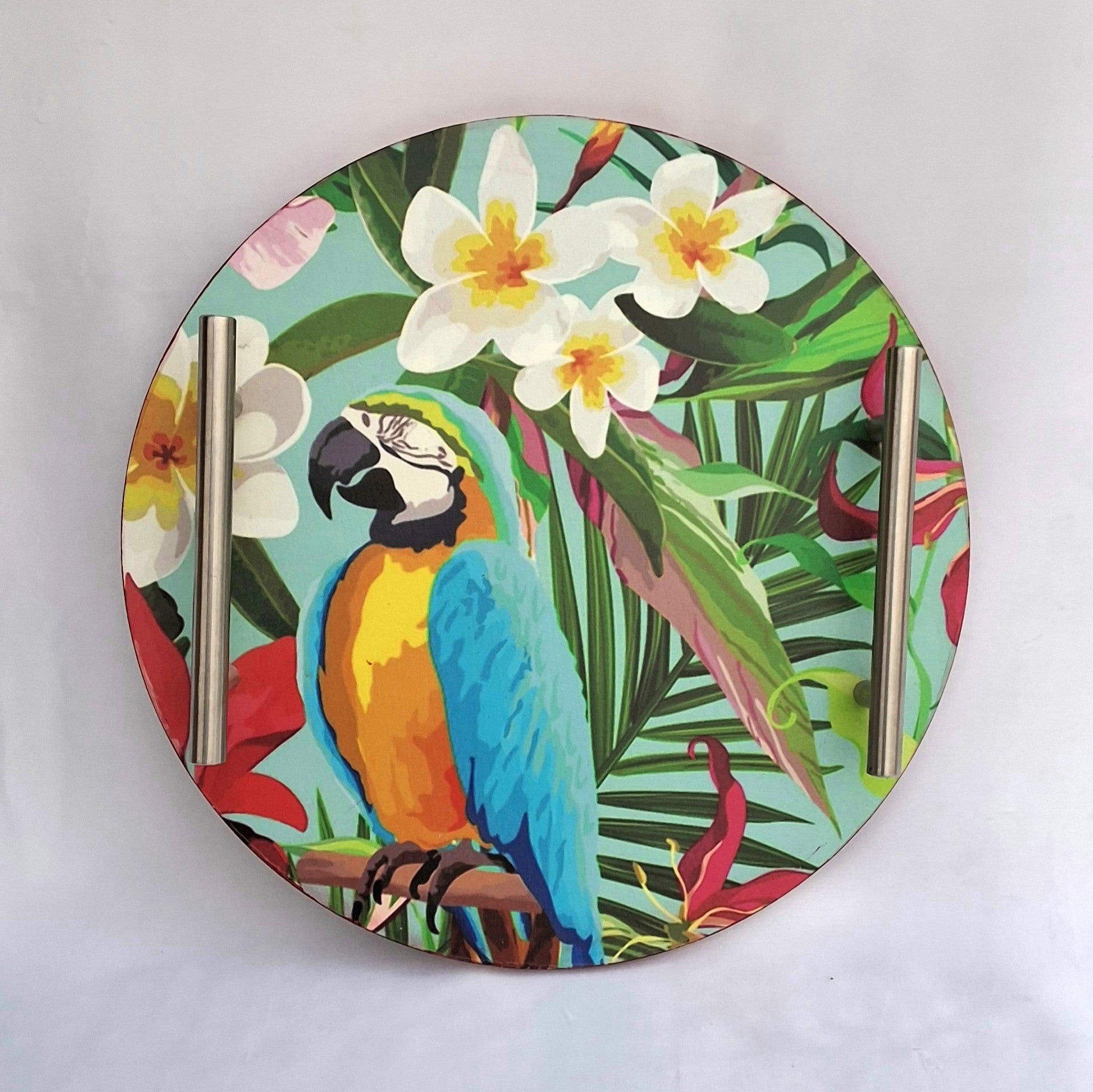 Wooden tray in Pakistan featuring a colorful print of Macaw, flowers and leaves. 