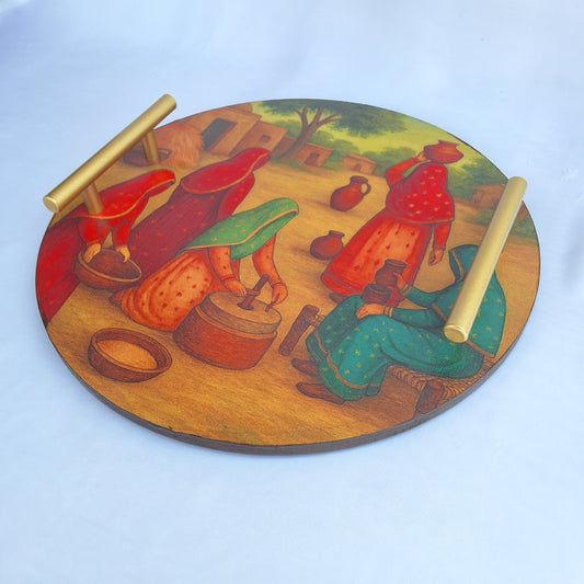 round wooden tray. digitally printed with picture of a Pakistani village showing Pakistani village women doing chores. serving tray, decorative tray